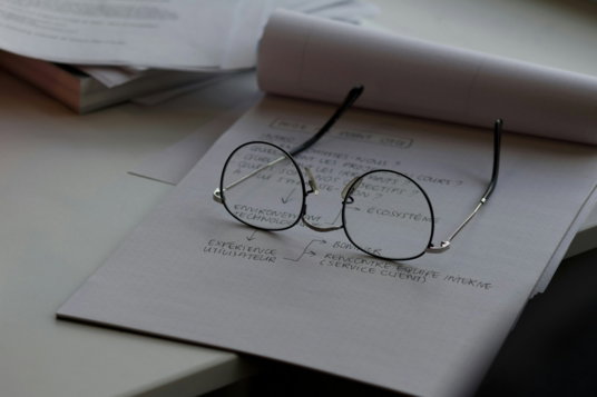 black-framed-eyeglasses-on-top-of-white-printing-paper.jpg black framed eyeglasses on top of white printing paper